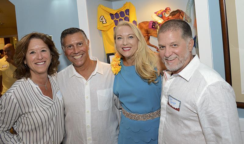 Sue Larsen, Rep. Steve Smyk, Cheryl Crowe and Scott Swingle gather for a photo.